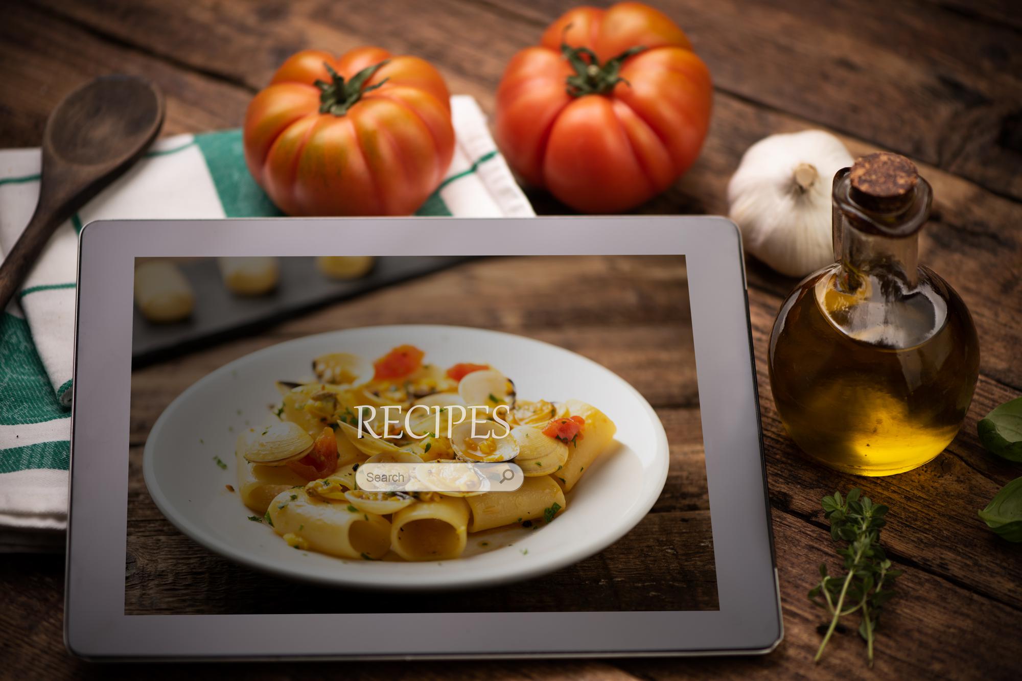 Open recipe booklet and plated course
